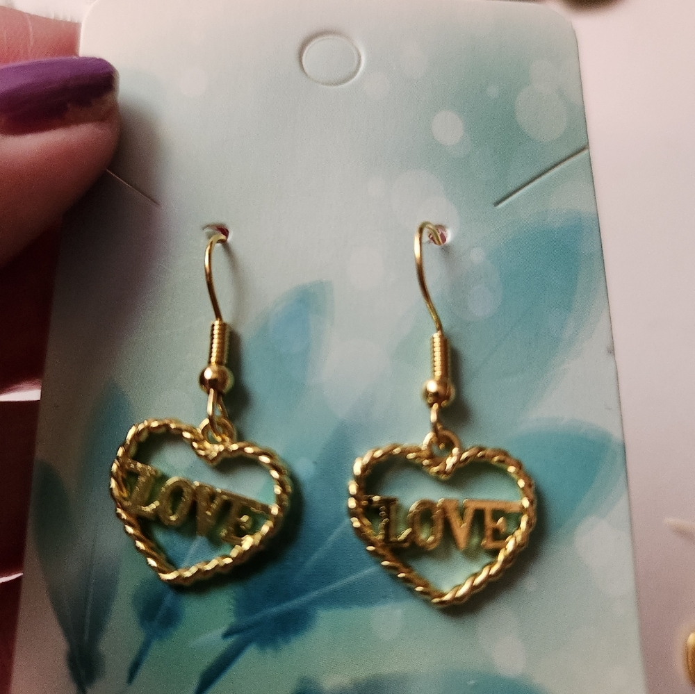 Gold tone "love" earrings